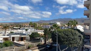 a view of a city with palm trees and buildings at Apartamento Callao Salvaje in Callao Salvaje