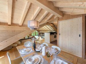 a dining room with a table and chairs at Appartement avec terrasse, à 350m des pistes, Le Bettaix - FR-1-570-48 in Praranger +11 photos