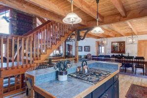 a kitchen with a stove top oven in a house at Boles Lodge in Boone