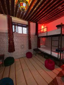 a room with two bunk beds and a stained glass window at la Kasbah salam in Fès +60 photos