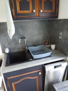 a kitchen counter with a sink and a sink at STUDIO Perpignan in Perpignan