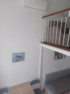 a small room with a table and a shelf at Loft House Budapest in Budapest