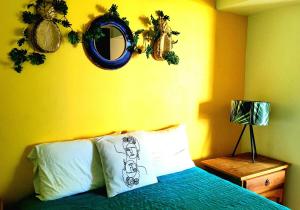 a bedroom with a bed and a mirror on the wall at Ocean View 2BR Apt at Resort, 1 Block to the Beach in Puerto Vallarta +36 photos