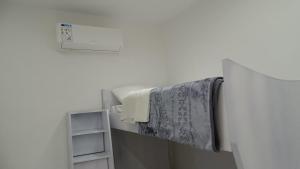 a towel hanging on a towel rack in a bathroom at Petra Luminous Apartment in Wadi Musa