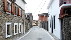 an alley in an old town with buildings at Art House Old Town in Podgorica