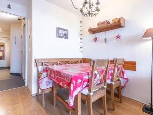 a dining room table with a pink table cloth on it at Appartement cosy pour 4 à Avoriaz avec balcon et internet - FR-1-314-117 in Avoriaz