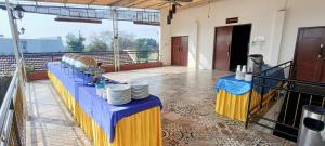 a table with plates on it in a room at Green Red Hotel Syariah Jombang in Jombang
