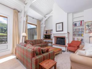a living room with two couches and a fireplace at Chalet d'exception à Avoriaz, 12 personnes, 7 pièces, ambiance alpine - FR-1-314-306 in Avoriaz