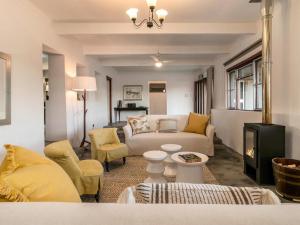 a living room with a couch and a table at Aardvark Bioreserve in Ladismith