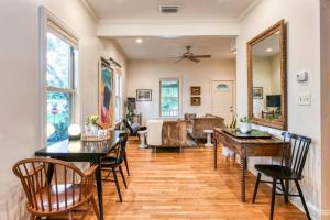 a living room with a table and chairs at Little Blue Cottage in St. Augustine