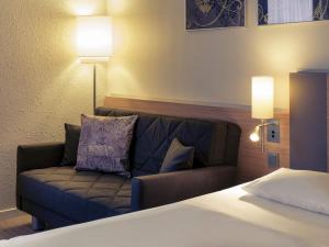 Giường trong phòng chung tại Fürther Hotel Mercure Nürnberg West