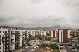 an aerial view of a city with buildings at Skylark - Toronto Penthouse with Jacuzzi & Mountain View in Braşov