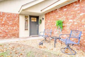 two blue chairs and a table in front of a house at Modern Bentonville Retreat - Sleeps 6 Near Trails in Bentonville +44 photos