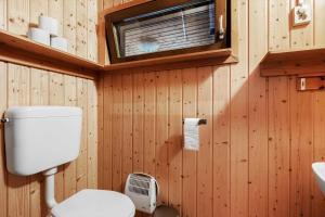 a bathroom with a toilet and a sink at VAS109-Kalv-Roesarp-Sperlingsholm-203 in Kalv +15 photos