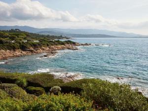 a view of the ocean from a rocky shore at Sofitel Golfe d'Ajaccio Thalassa Sea & Spa in Ajaccio