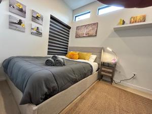a bedroom with a large bed in a room at Nestle By The Falls - Niagara Falls in Niagara Falls