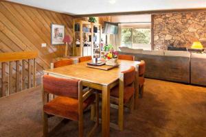 a dining room with a wooden table and chairs at Snowcreek #059 Near Shuttle & Activities in Mammoth Lakes