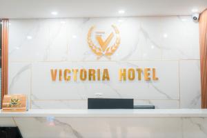 a sign for a hotel in front of a building at Victoria Hotel Me Tri in Hanoi +80 photos