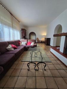 a living room with a couch and a coffee table at Il giardino di Anna in Palestrina