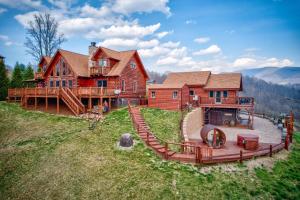 a large wooden house on top of a hill at Ponderosa 1887 in Vilas