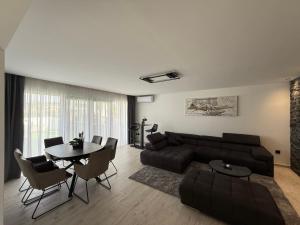 a living room with a couch and a table at San Nikola in Vrdnik