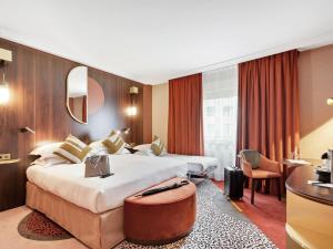 Ένα ή περισσότερα κρεβάτια σε δωμάτιο στο Nest Hotel Paris la Défense - MGallery Collection