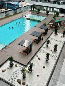 an overhead view of a swimming pool in a building at 168 Park Selayang by Iconique in Batu Caves
