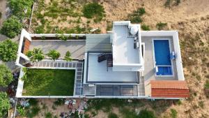 an overhead view of a house with a yard at VB beach Villa at ECR mugaiyur in Kūvattūr