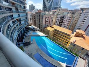 an overhead view of a swimming pool in a city at Book Santos - Unlimited 901 - Frente Mar com Vista Panorâmica in Santos