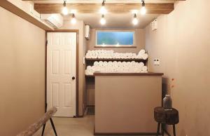 a room with a counter and a door with a window at Bungalow One - Vacation STAY 49000v in Kawaguchi