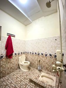 Koupelna v ubytování Comfy Stay Inn + 2 fotografie