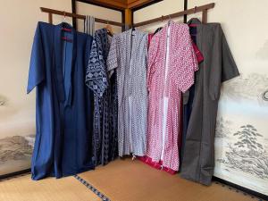 a bunch of shirts are hanging on a rack at Oshu - House - Vacation STAY 19753 in Hiraizumi