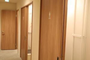 a room with wooden doors and a hallway at 2-times,Dormitory Hotel - Vacation STAY 43019v in Itoshima