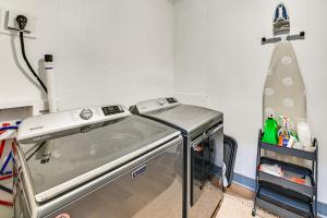 a kitchen with a dishwasher in a room at Herrington Lake Retreat with Dock, 1 Mi to Marina! in Bushtown +34 photos