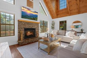 a living room with a fireplace and a couch at Vista View in Sugar Grove
