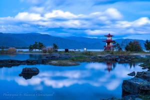 a pagoda in the middle of a body of water at The Lakehouse at Toyako - Vacation STAY 44254v in Tōya +11 photos
