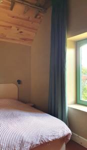 Ένα ή περισσότερα κρεβάτια σε δωμάτιο στο De groene linde