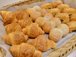 a basket full of pastries on a table at Smile Hotel Osaka Tennoji - Vacation STAY 41030v in Osaka