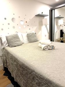 a bedroom with a large bed and a mirror at Manu Double Room in London