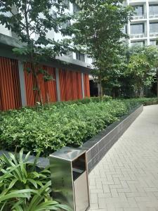 a wall of plants in front of a building at Luxury Suites - Agile Residence Bukit Bintang in Kuala Lumpur