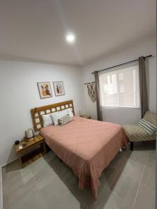 Rúm í herbergi á Artemissa Department