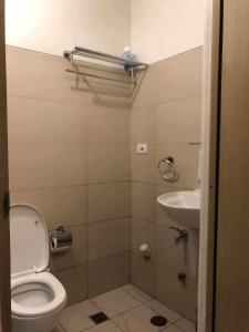 a small bathroom with a toilet and a sink at Great Escape - Wind Residences in Kaybagal +24 photos