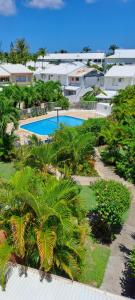 an aerial view of a resort with a swimming pool at Evasion Tropicale in Saint-François +2 photos