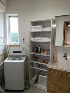 a laundry room with a washer and a sink at Star Dome - Vacation STAY 20283 in Shimoda