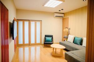 a living room with a couch and a table at Takayama - House - Vacation STAY 49009v in Takayama