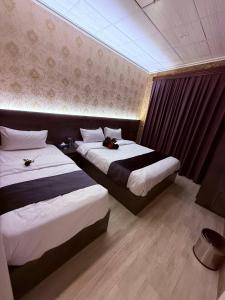 Ένα ή περισσότερα κρεβάτια σε δωμάτιο στο Hotel Vote 2 Erbil +22 φωτογραφίες