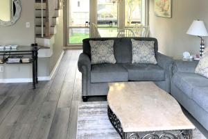 a living room with a couch and a coffee table at Sea Colony - 3101 Round Robin Way in Bethany Beach