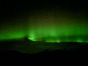 an image of the northern lights in the sky at Guesthouse Mikael in Höfn