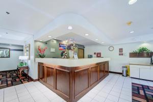 a lobby of a hospital with a reception counter at Capital O Amerihost Inn and Suites Fulton Hwy 54 MO in Fulton +47 photos