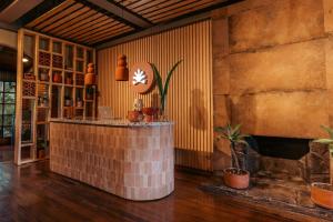 a bar in a room with a brick wall at awā San José in San José